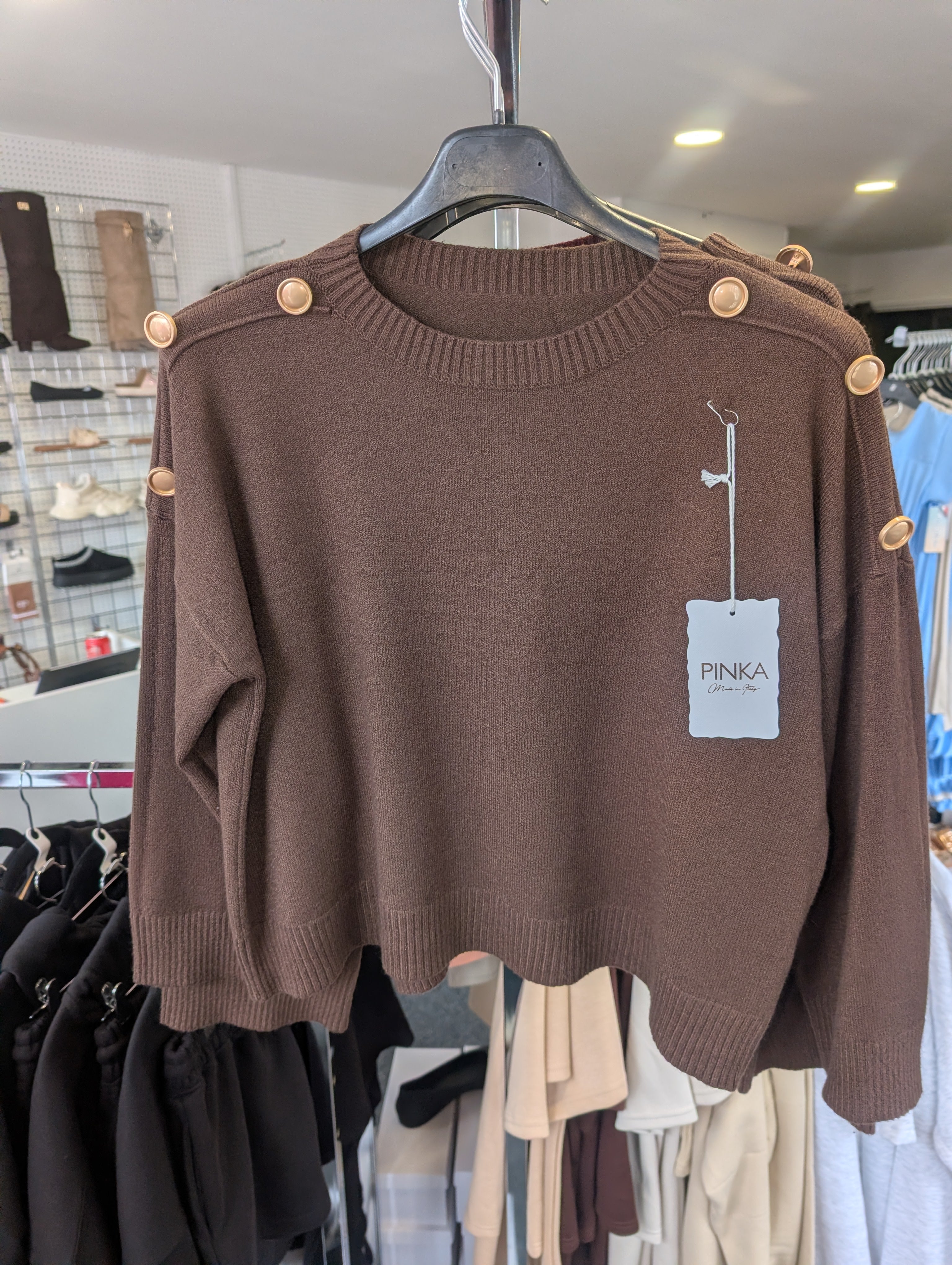 Long-Sleeved Knitted Sweater Features A Round Neckline And Distinctive Gold-Tone Decorative Buttons