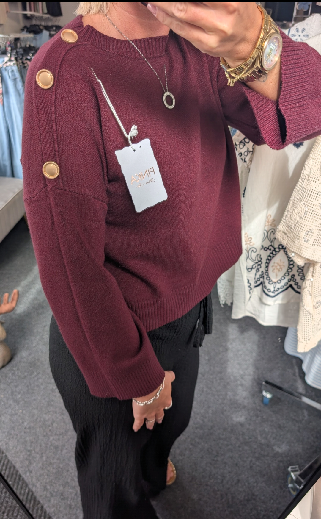 Long-Sleeved Knitted Sweater Features A Round Neckline And Distinctive Gold-Tone Decorative Buttons