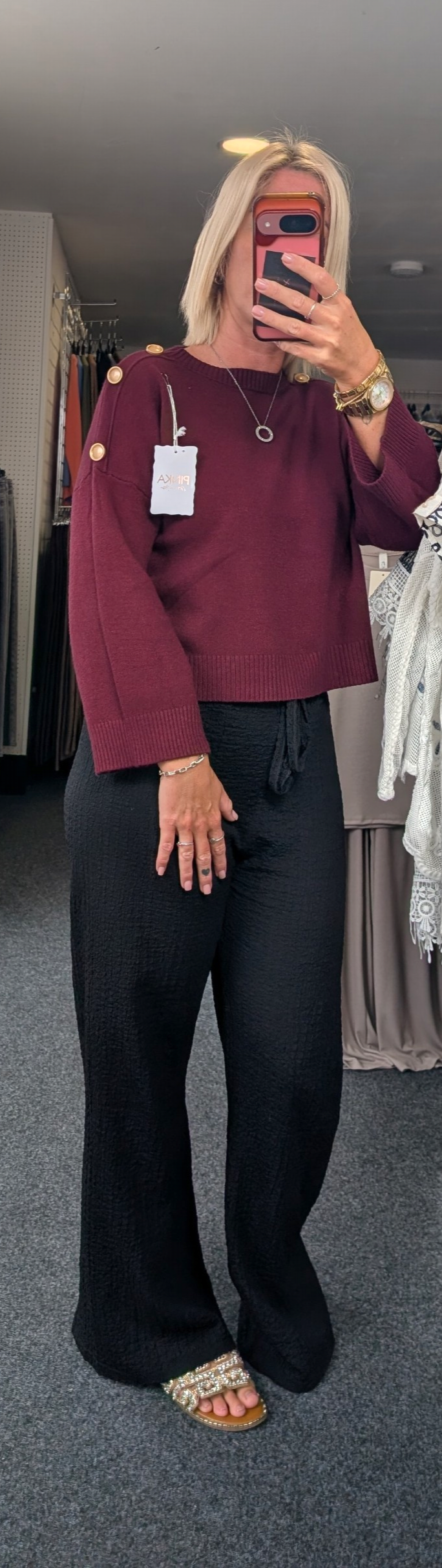 Long-Sleeved Knitted Sweater Features A Round Neckline And Distinctive Gold-Tone Decorative Buttons