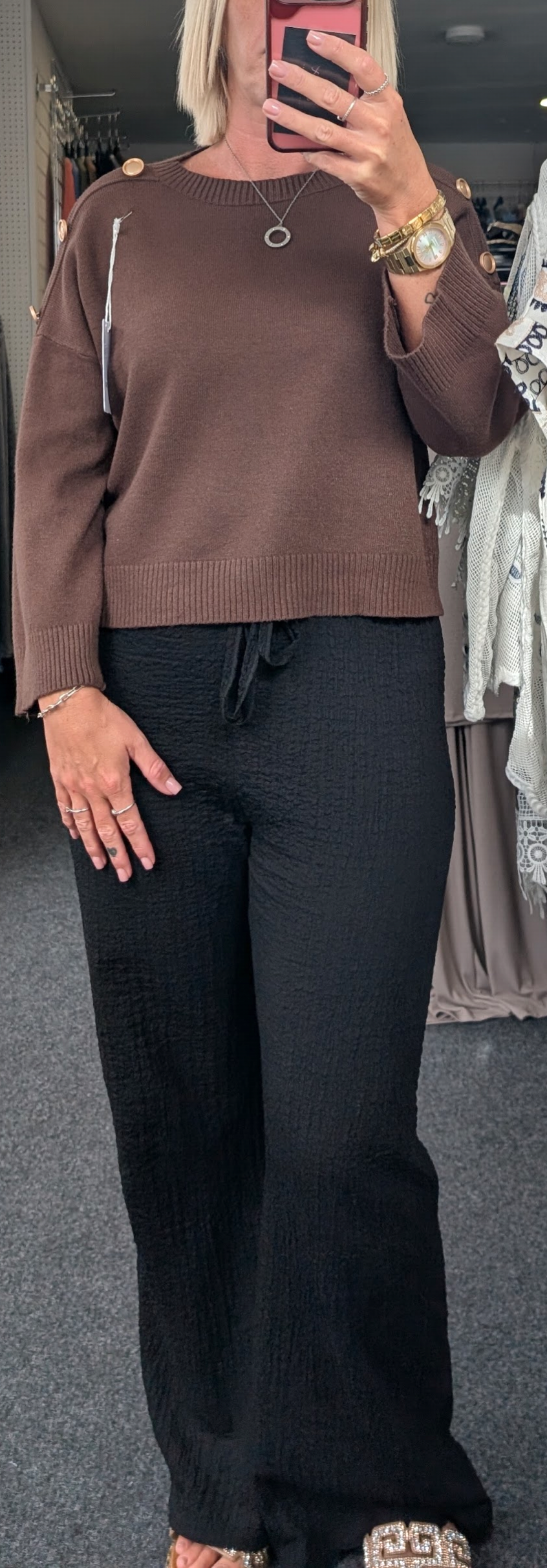 Long-Sleeved Knitted Sweater Features A Round Neckline And Distinctive Gold-Tone Decorative Buttons