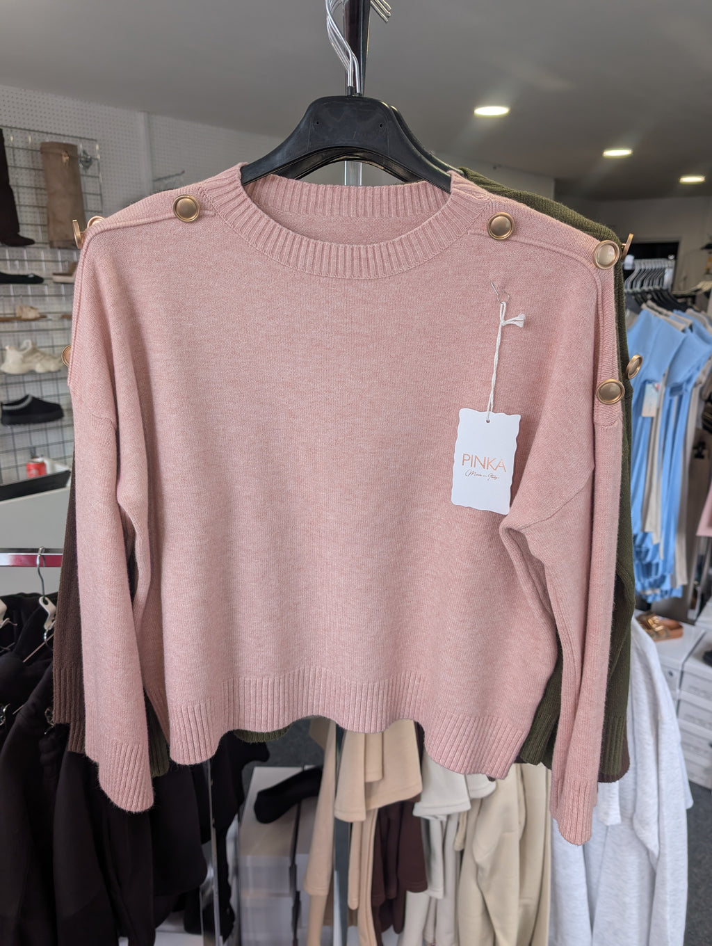Long-Sleeved Knitted Sweater Features A Round Neckline And Distinctive Gold-Tone Decorative Buttons