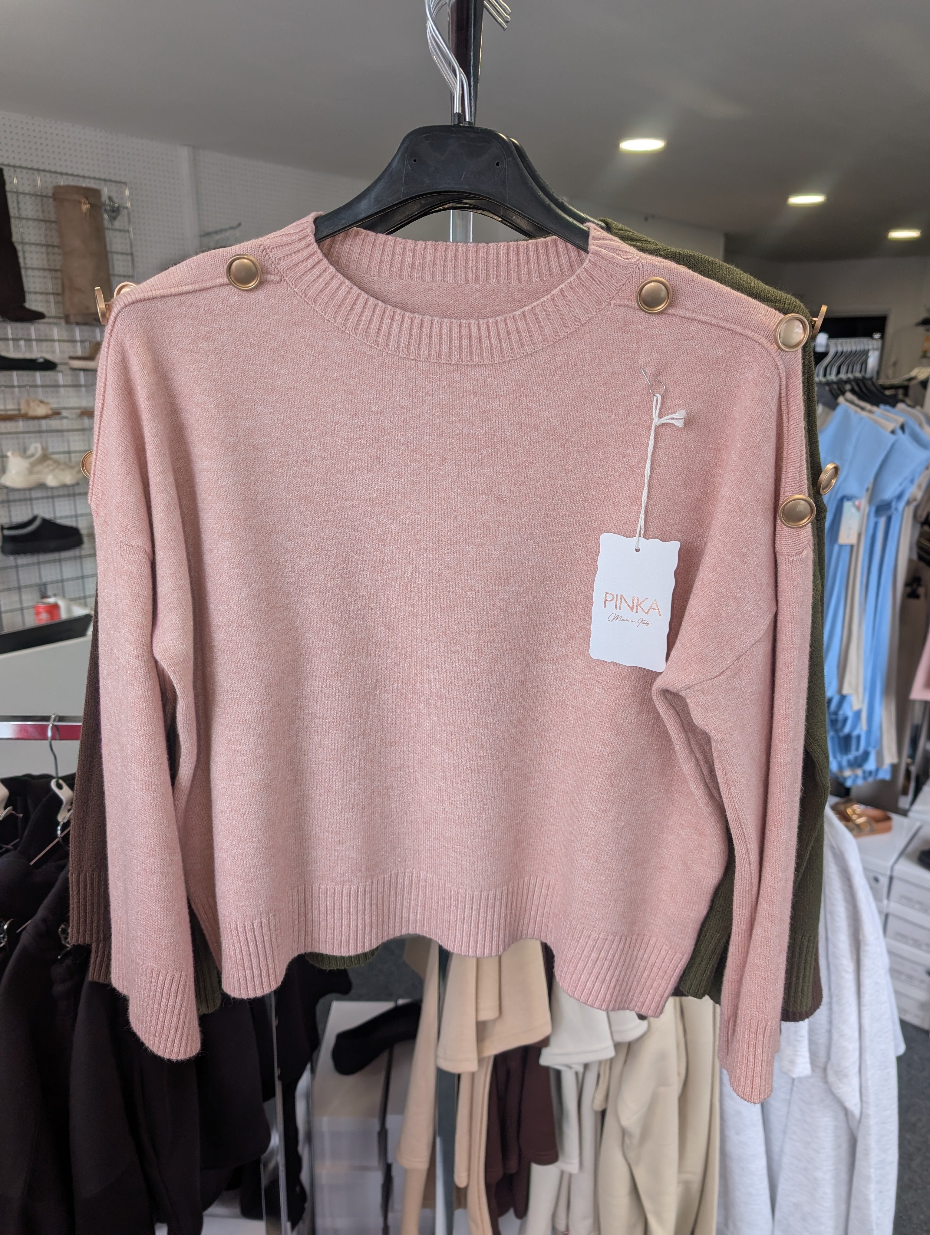 Long-Sleeved Knitted Sweater Features A Round Neckline And Distinctive Gold-Tone Decorative Buttons