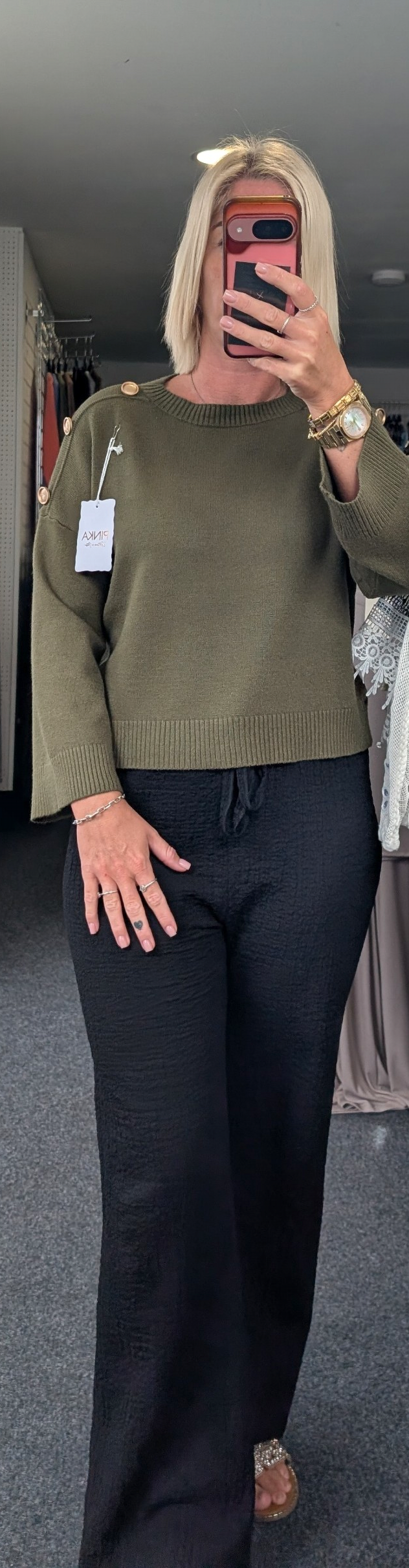 Long-Sleeved Knitted Sweater Features A Round Neckline And Distinctive Gold-Tone Decorative Buttons