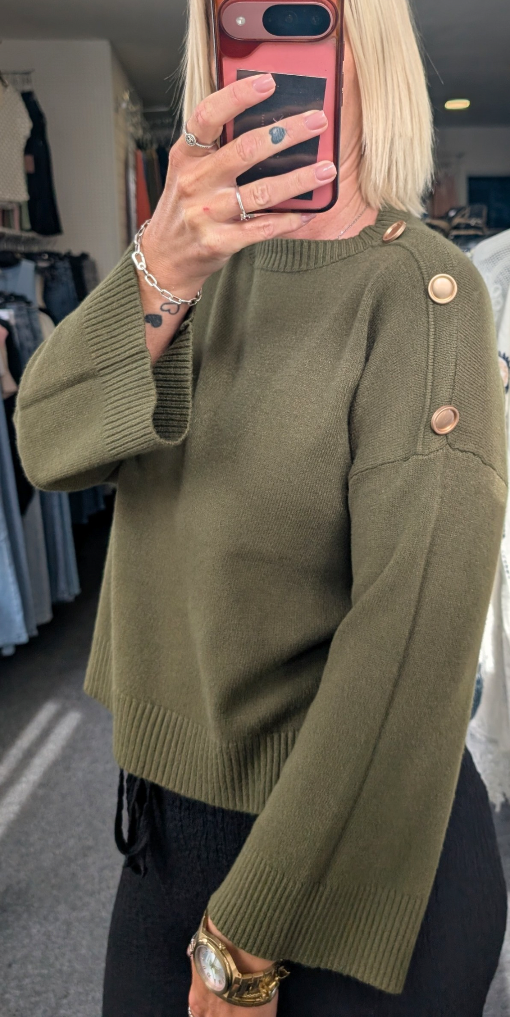 Long-Sleeved Knitted Sweater Features A Round Neckline And Distinctive Gold-Tone Decorative Buttons
